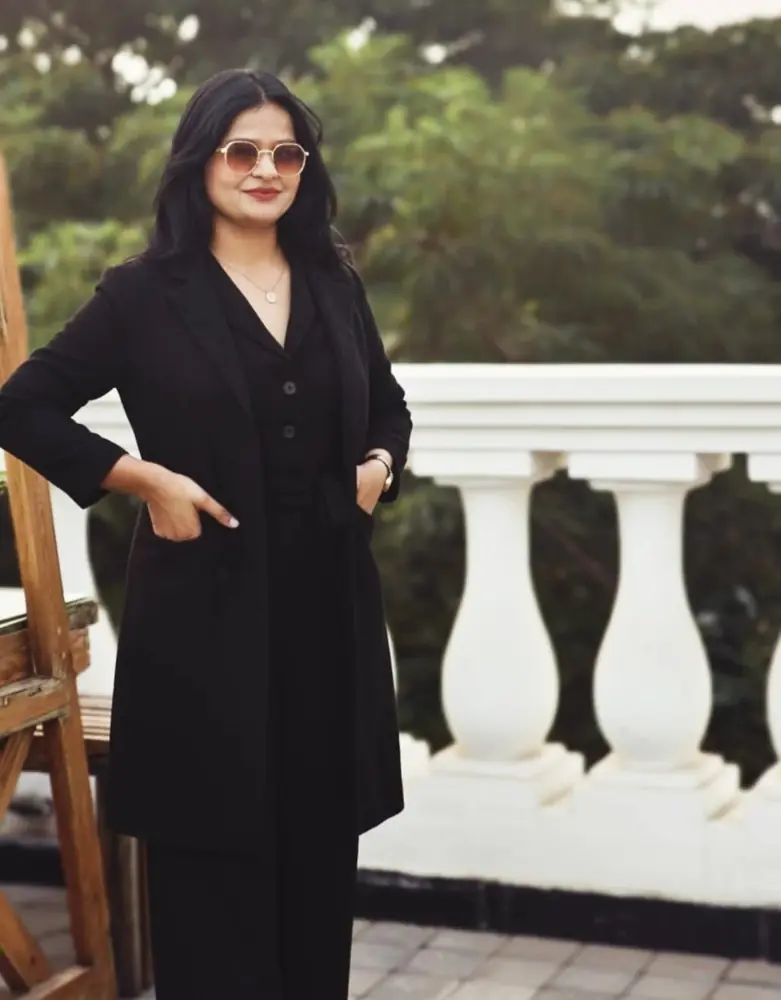 Anupriya Tripathi in a black suit